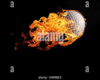 Close up of a burning golf ball flying on a black background Stock Photo