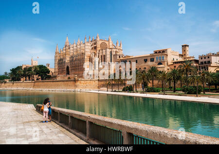 Palma de Mallorca, Spain - May 27, 2016: Park de la Mar against La Seu, the gothic medieval cathedral of Palma de Mallorca, Spain. The Cathedral of Sa Stock Photo