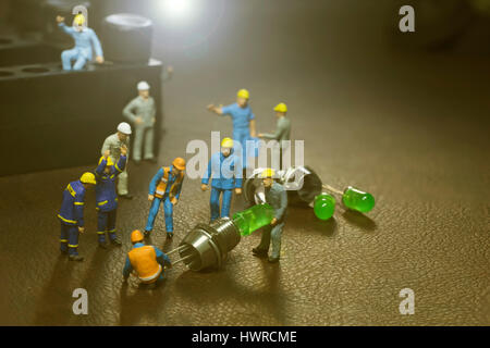 mini worker team working in manufacture and lens fare filter - can use to display or montage on products Stock Photo