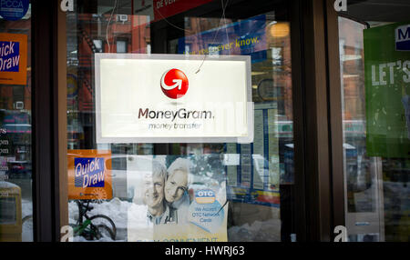 A store in New York offering MoneyGram services on Wednesday, March 15, 2017. After agreeing to be acquired by the Chinese Ant Financial Services, MoneyGram now has a bid by Kansas-based Euronet Worldwide for substantially more. (© Richard B. Levine) Stock Photo