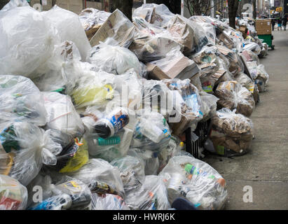 Bags of recyclable trash awaiting pick-up in the Chelsea neighborhood of New York on Saturday, March 18, 2017. As the snow melts from out recent storm the Dept. of Sanitation is starting to resume trash collection.  (© Richard B. Levine) Stock Photo