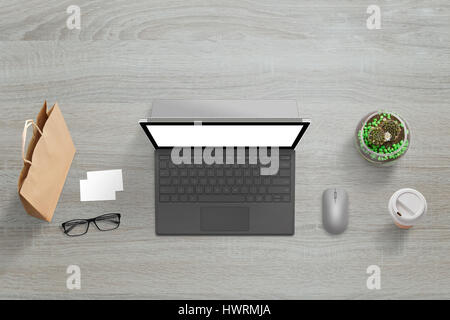 Top view of keyboard with white isolated screen for web site presentation. Bag, glasses, business card, mouse, plant and coffee beside. Stock Photo
