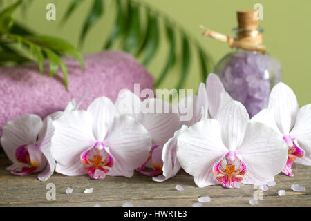Spa still life with bath salt towel and orchids on wooden boards Stock Photo