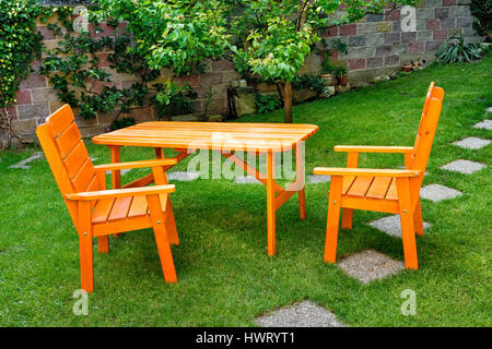 a deska and two chairs in the garden Stock Photo
