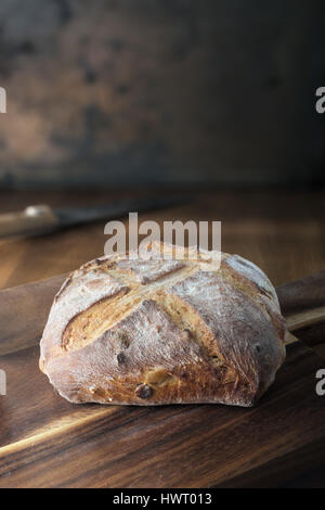 Rustic bread on cutting board
