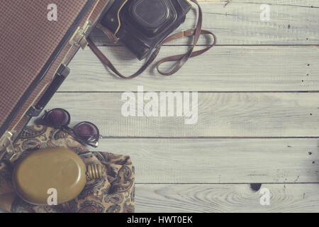 Man's hat and retro accessories for travel on a white painted wooden surface Stock Photo