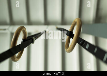 Directly below shot of gymnastic rings hanging on ceiling Stock Photo