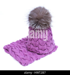Violet knitted woolen scarf and hat with pompom isolated on white background Stock Photo