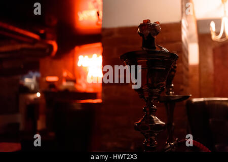 Ready hookah in the bar on a colorful background. Stock Photo