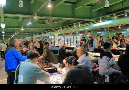 People visit Jianguo weekend Jade Market in Taipei Taiwan. Jianguo Jade Market is a major Jade market in Taipei. Stock Photo