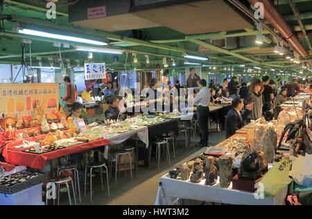 People visit Jianguo weekend Jade Market in Taipei Taiwan. Jianguo Jade Market is a major Jade market in Taipei. Stock Photo