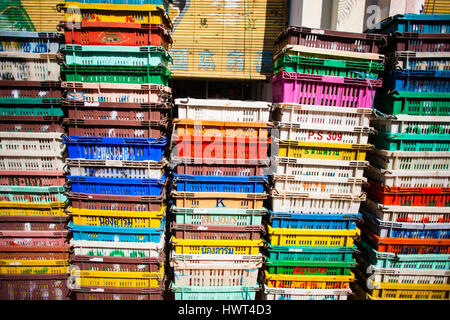 Boxes of grey and white plastic pipes in a warehouse. Storage boxes Stock Photo