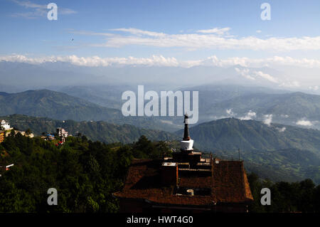 Roof top view on nepalese himalayas and hotel with stupa (mortar) on it - morning in nagarkot Stock Photo