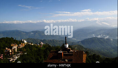 Roof top view on nepalese himalayas and hotel with stupa (mortar) on it - morning in nagarkot Stock Photo