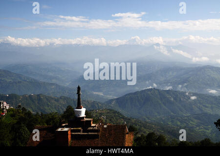 Roof top view on nepalese himalayas and hotel with stupa (mortar) on it - morning in nagarkot Stock Photo