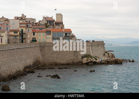 View over the old town of Antibes with the fortified walls direct over the sea. Stock Photo