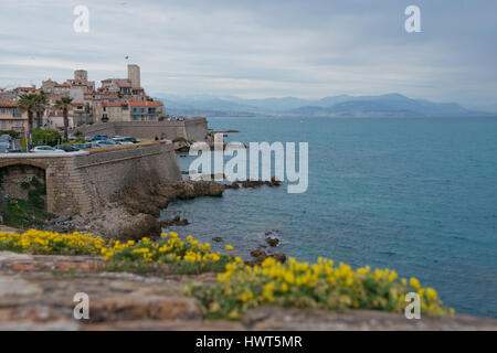 View over the old town of Antibes with the fortified walls direct over the sea. Stock Photo