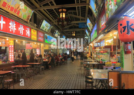 People visit Huaxi street night market in Taipei Taiwan. Stock Photo