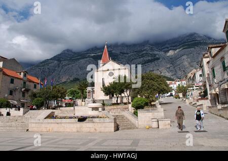 The Church of Saint Mark at Makarska in Croatia with the Biokovo mountain in the background. The church was built in 1776. Stock Photo