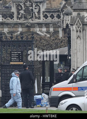 Police forensic officers outside the Houses of Parliament in London ...
