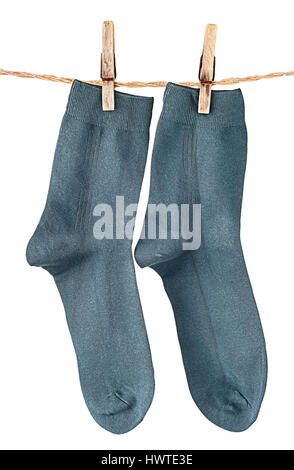 Dark blue socks on rope with clothespins isolated on white background Stock Photo