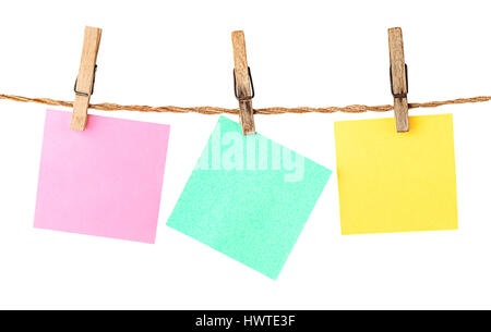 Multicolored paper stickers on clothespins isolated on white background Stock Photo