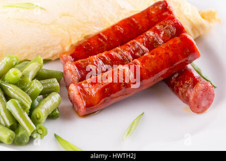 breakfast with omelet, asparagus and sausages. Stock Photo