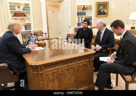 U.S President-elect Donald Trump meets with Washington Mayor Muriel Bowser, left, Paul Wiedefeld, General Manager of the Washington Metropolitan Area Transit Authority, center, and Tom Bossart, Homeland Security Advisory in the Oval Office the White House March 13, 2017 in Washington, DC. Trump held the meeting to discuss emergency response for a winter blizzard warning which is set to hit the region. Stock Photo