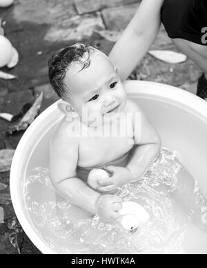 Regret , Asian baby boy feeling regret and upset when mother taking him out of bath tub