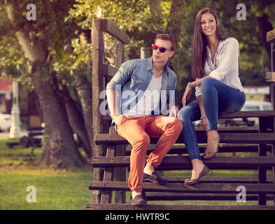 Young beautiful couple in nature, sitting and relaxing Stock Photo