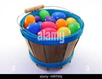 Assorted colored easter eggs in wooden bucket Stock Photo
