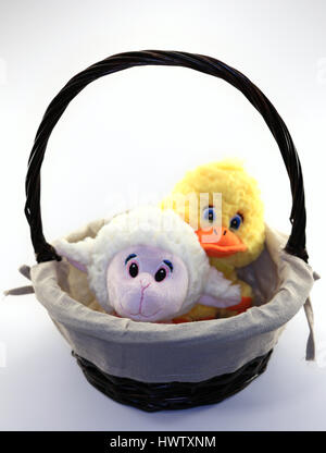 Cute lamb and duckling in wicker basket Stock Photo