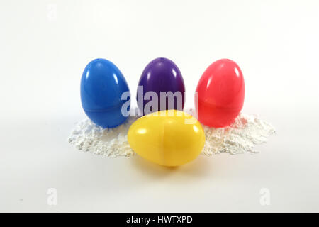 assorted colored easter eggs on powdered sugar Stock Photo