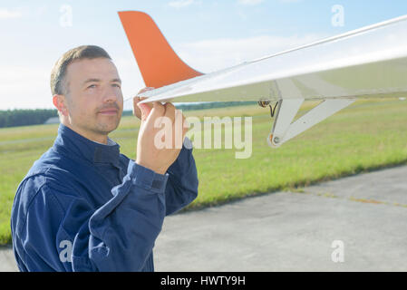 engineer flying remote control glider Stock Photo