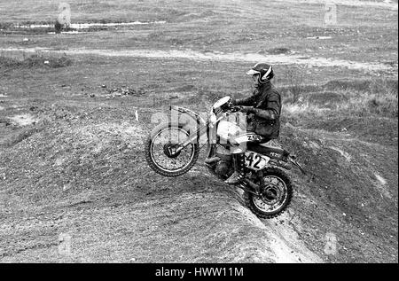 Competitors struggle in the mud at the Sudbury Stages Enduro motorcycle event at Sudbury in Suffolk, England on November 27, 1977. Stock Photo