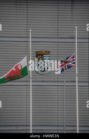 Aberystwyth, Ceredigion West, UK. 23rd Mar, 2017. The Welsh Flag and the union flag both at half mast outside the council offices of Ceredigion, in respect to those killed in Westminster, London yesterday. Credit: andrew chittock/Alamy Live News Stock Photo
