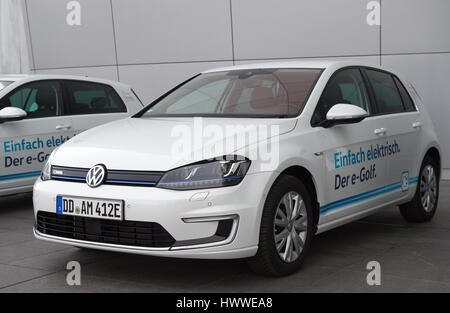 A Volkswagen E-Golf is charged at the Transparent Factory ('Glaeserne Manufaktur') of Volkswagen in Dresden, Germany, 23 March 2017. One year after the production stop of the VW Phaeton, the Transparent Factory is used again for building cars. The first new E-Golf models were brought onto the conveyor belt this week. The first client car is said to be done one week after Monday. Photo: Arno Burgi/dpa-Zentralbild/dpa Stock Photo