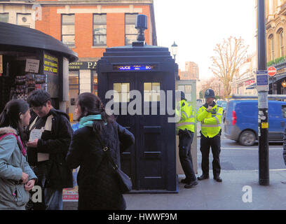 London, UK. 23rd Mar, 2017. In the wake of yesterday's terror attack, Mayor Sadiq Khan adds extra police patrols to the streets of London. Here two policeman stand outside one of the last remaining Police Boxes in the UK, outside Earl`s Court Station-the much visited Tardis of Doctor Who Credit: Brian Minkoff/Alamy Live News