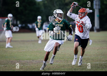 Jupiter, Florida, USA. 23rd Mar, 2017. Jupiter Warriors midfielder Tanner Gabriel (5) runs past Benjamin Buccaneers defender Christian Cropp (10) during the first quarter at Jupiter Community Park on Thursday, Mar. 23, 2017. Credit: Michael Ares/The Palm Beach Post/ZUMA Wire/Alamy Live News Stock Photo