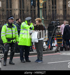 London, UK Thursday March 23, 2017 Police officers stand guard on a road leading to the Houses of Parliament in London. After the terrorist attack Credit: Elena Rostunova/Alamy Live News Stock Photo