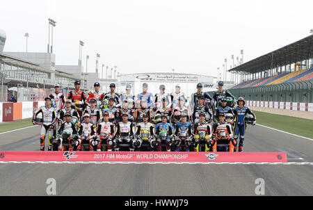 Doha, Qatar. 23rd Mar, 2017. Moto2 riders pose during a photo session before 2017 MotoGP Grand Prix of Qatar Free Practice 1 in Losail Circuit of Doha, capital of Qatar, on March 23, 2017. Credit: Nikku/Xinhua/Alamy Live News Stock Photo