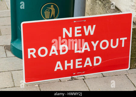 New Road Layout ahead sign on ground, fallen from post Stock Photo