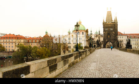 Lonely runner at Charles bridge in morning jogging at sunrise. Stock Photo