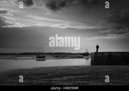 man standing on pier silhouette Stock Photo