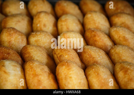 Fresh doughnuts in a roadside cafe on the road to Mandalay, Myanmar Stock Photo