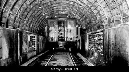 Photograph showing a subway car traveling through a tunnel during construction of the Hudson and Manhattan Tunnels, New York City, New York, 1908. Stock Photo