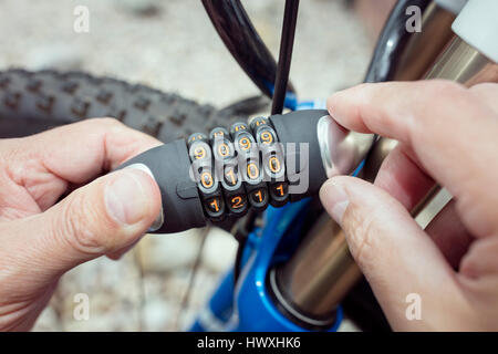 Combination lock bicycle accessory for bike protection and security Stock Photo