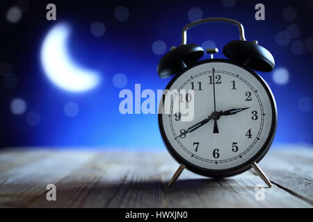 Alarm clock in the middle of the night insomnia or dreaming Stock Photo