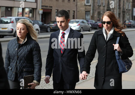 American airline pilot Paul Brady Grebenc, 35, arrives with his wife Emily (right), at Paisley Sheriff Court, where he and fellow pilot Carlos Roberto Licona, 45, have been released on bail and charged with being under the influence of alcohol as they prepared to fly a passenger jet from Scotland to the US. Stock Photo