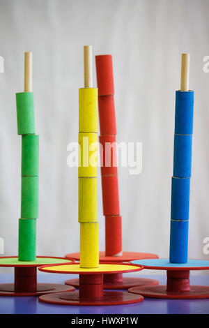 Homemade, do-it-yourself educational toys, arranging and sorting colors. Learning through experience concept, intelligence development, educational ap Stock Photo